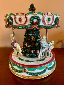 lot 152 image: Christmas Carousel Music Box, Santa Figurine and Rocking Horse Figurine