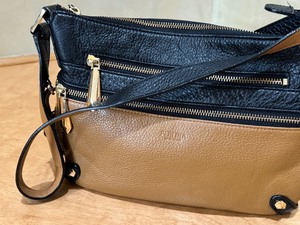 lot 45 image: Brown and Black Leather Perlina Handbag