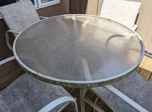 lot 216 image: Glass Topped Metal Patio Set
