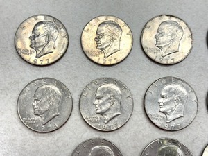 lot 34C image: (12) 1977 Eisenhower Dollar Coins and (1) 1978 Eisenhower Dollar Coin