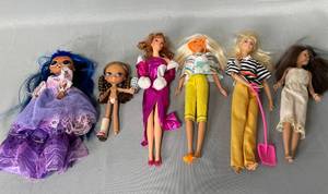 4 Barbies and 2 Other Doll Toys