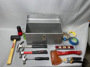 Metal Tool Box, 3 Hammers (Various Sizes), Tape, 9 Level, Hatchet, Fiskars Cutters, Rubber Mallet, Small Flashlights, Misc. Tie Downs and Screws in Bottom of Tool Box