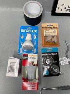 Stanley Hacksaw, Hacksaw Blades, Rope, Thin Bungee Cords, Tongs, Leg Screw Eyes, Toilet Flapper, Cabinet Door Knobs, Great Neck Saw, 200W Soft White Bulb, and More