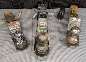 lot 127 image: (3) Trailer Hitches Curt 1 78 Ball, Reese 2 516 Ball, Rigid 2 Ball, Reese Reducer Sleeve & Trailer Connector