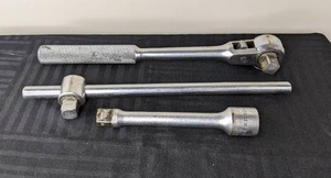 lot 8 image: 12 Ratchet, Extension, and Short Handle Breaker Bar
