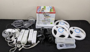 lot 14A image: Nintendo Wii Gaming System with Accessories Remote Controllers, Steering Wheels, Microphone, Games and More