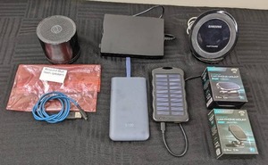 lot 37A image: Magnetic Car Phone Mounts, Samsung Fast Charge, Samsung 5100mAh Power Bank, Solar Charging Bank, Resound Blue Tooth Speaker, Etc.
