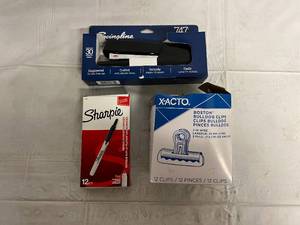 lot 153 image: Stapler, Fine Point Sharpies, and Xacto Boston Bulldog Clips