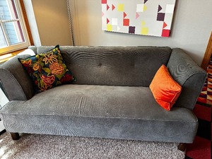 Grey Upholstered Sofa with Two Cushions Measuring 71 x 30 x 30, In excellent condition