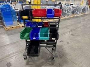 lot 73 image: Akro Mills Two-Sided Rolling Bin Cart with 24 Various Sized Bins