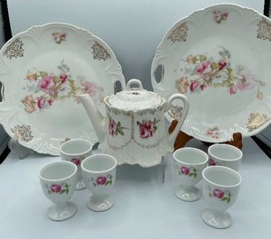 lot 75 image: Two Pink Rose China Plates, Tea Pot and 6 Egg Cups