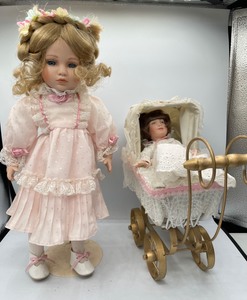 lot 177 image: 2 Porcelain Dolls and Baby Doll Buggy