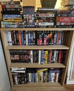 lot 439 image: 150 VHS Movies and Wood Bookshelf