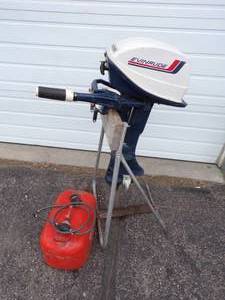 lot 3 image: Evinrude Fisherman 6 HP Outboard Motor with Hose and Tank