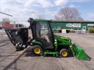 lot 1A image: 2015 JD 1025R tractor with loader, 60 mid mount mower, Lift & dump bagger, 48 snowblower