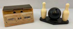 lot 20 image: Vintage Bowling Bowl,  Pins Salt & Pepper Shakers And Bakelite Desk OrganizerCalendar