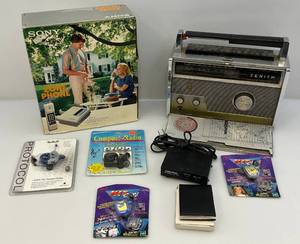 lot 194 image: Misc. Vintage Electronics Including Sony Zone Phone (NIB), Zenith Trans-Oceanic Rotal 1,000 Radio (Handle Broke) & More