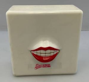 lot 201 image: Vintage Red Crme Scream Machine Animated Lips Transistor Radio (WORKS)