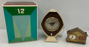 lot 294 image: Two Vintage Clocks 1 Brass House Clock & 1 Brown & Bigelow Art Deco In Original Box