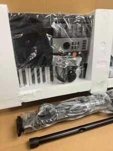 lot 12 image: Electronic Keyboard Piano with microphone and headphones  stand included