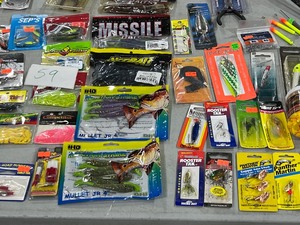 lot 59 image: TABLE FULL OF FISHING RODREEL, SNELLS, LINE, PLASTICS, JIGS, SPOONS, WEIGHTS, LEADERS, SPINNERS, HOOKS, & LURES
