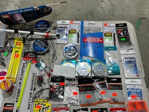 lot 61 image: TABLE FULL OF FISHING RODREEL, SNELLS, LINE, PLASTICS, JIGS, SPOONS, WEIGHTS, LEADERS, SPINNERS, HOOKS, & LURES