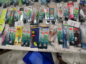lot 25 image: TABEL FULL OF BIG TACKLE JIGS, LEADERS, & SWIVELS