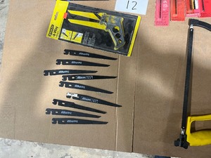 lot 12 image: TABLE FULL OF SAWS & BLADES