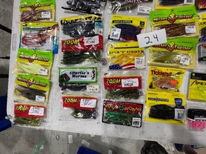 lot 24 image: TABLE FULL OF PLASTICS, LINE, HOOKS, SNELLS, LEADERS, & JIGS