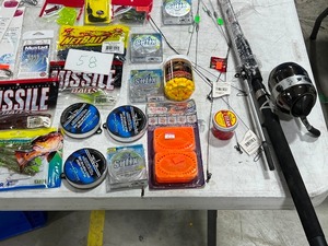 lot 58 image: TABLE FULL OF FISHING RODREEL, SNELLS, LINE, PLASTICS, JIGS, SPOONS, WEIGHTS, LEADERS, SPINNERS, HOOKS, & LURES