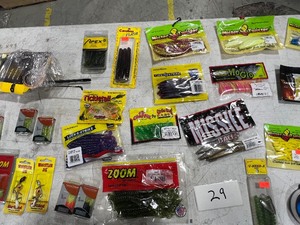lot 29 image: TABLE FULL OF FISHING RODREEL, SNELLS, LINE, PLASTICS, JIGS, HOOKS, & LURES