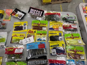 lot 23 image: TABLE FULL OF PLASTICS, LINE, HOOKS, SNELLS, LEADERS, & JIGS