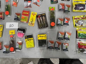 lot 30 image: TABLE FULL OF FISHING RODREEL, SNELLS, LINE, PLASTICS, JIGS, HOOKS, & LURES