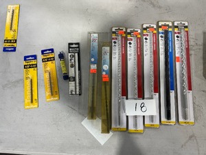 lot 18 image: TABLE FULL OF MASONRY DRILL BITS $170