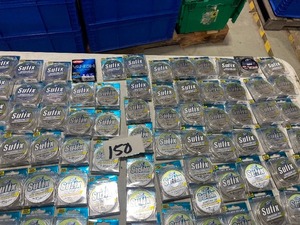 lot 150 image: TABLE FULL OF FISHING LINE