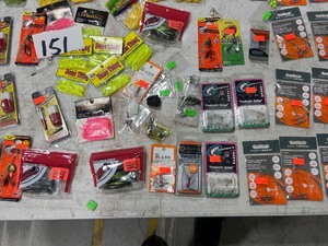 lot 151 image: TABLE FULL OF JIGS, PLASTICS, SPOONS, SPINNERS, RIGS, & HOOKS