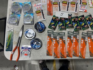 lot 5 image: TABLE FULL OF FISHING JIGS , LEADERS,  LINE