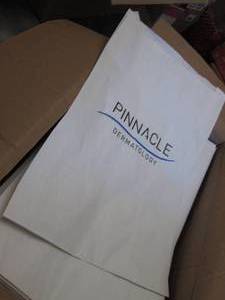 lot 190 image: Box of 500- 15x18 inch Branded Pape...