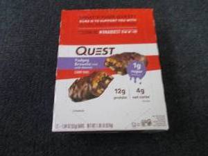 lot 299 image: 12 Quest Fudgey Brownie Candy Bars...