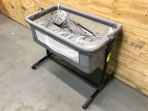 lot 24 image: Bedside Crib with Adjustable Height, Portable Bed for InfantNewborn (It is missing Parts) Model # 968