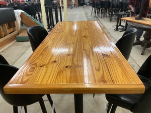 High top Pine finished table with 4 swivel bar stools