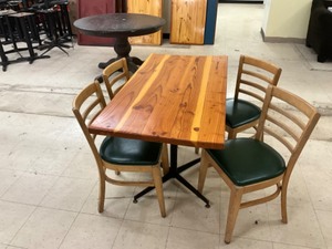 Low top Pine finished table with 4  hardwood padded chairs