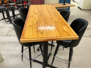 High top Pine finished table with 4 swivel bar stools