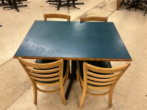 Low top bar table with 4 padded hard wood chairs