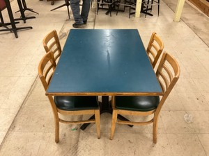 Low top bar table with 4 padded hard wood chairs