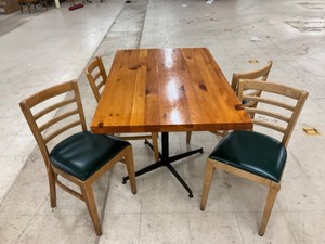 Low top bar table with 4 padded hardwood chairs