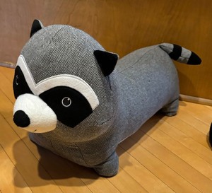 lot 72 image: Mickey Mouse Pillow with Raccoon Footrest