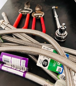 lot 341 image: Tools and Faucet Hoses in Many Sizes