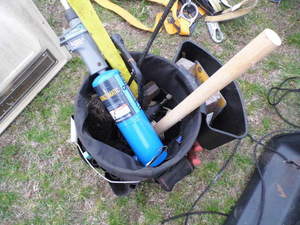 Bucket filled with hand tools and a...