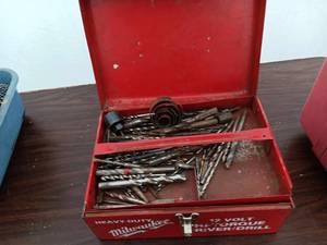 Milwaukee drill in a case with acce...